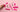 a hand touching pink sex toys and nipple clamps on a salmon coloured background